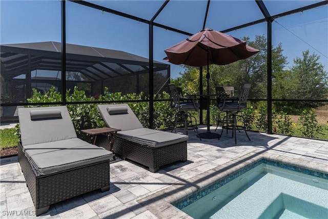 view of patio featuring a swimming pool and glass enclosure