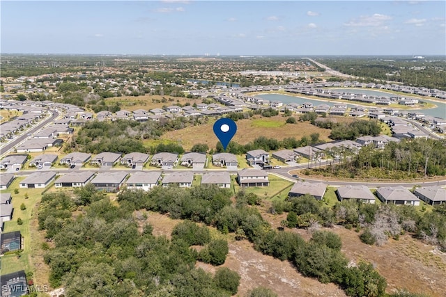 bird's eye view featuring a water view and a residential view