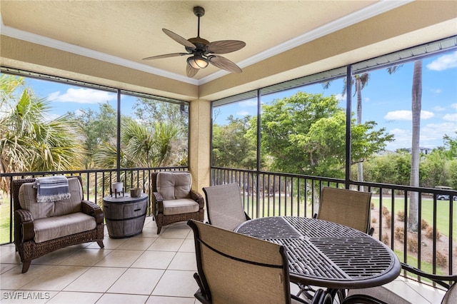 11239 Bienvenida Ct Unit 11C, Fort Myers, FL 33908 - sunroom with ceiling fan and view of scattered trees