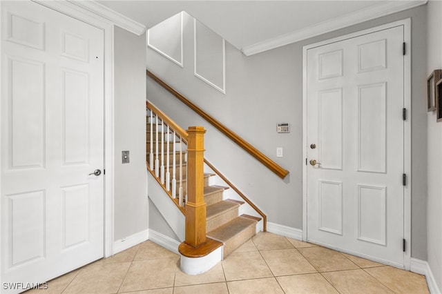 11239 Bienvenida Ct Unit 11C, Fort Myers, FL 33908 - entrance foyer featuring baseboards, crown molding, stairs, and light tile patterned floors