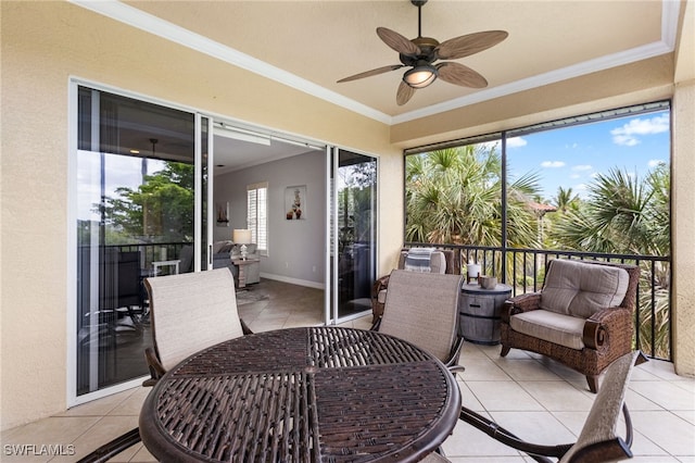 11239 Bienvenida Ct Unit 11C, Fort Myers, FL 33908 - sunroom with a ceiling fan, crown molding, outdoor dining space, and tile patterned flooring