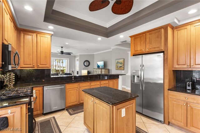 11239 Bienvenida Ct Unit 11C, Fort Myers, FL 33908 - kitchen with appliances with stainless steel finishes, ceiling fan, a sink, light tile patterned floors, and ornamental molding