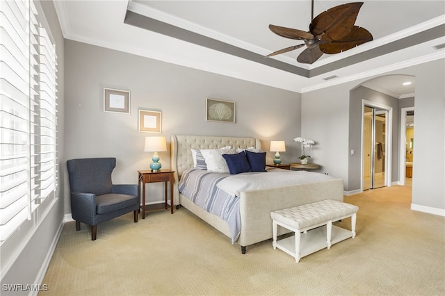 11239 Bienvenida Ct Unit 11C, Fort Myers, FL 33908 - bedroom featuring light carpet, arched walkways, a tray ceiling, and ornamental molding