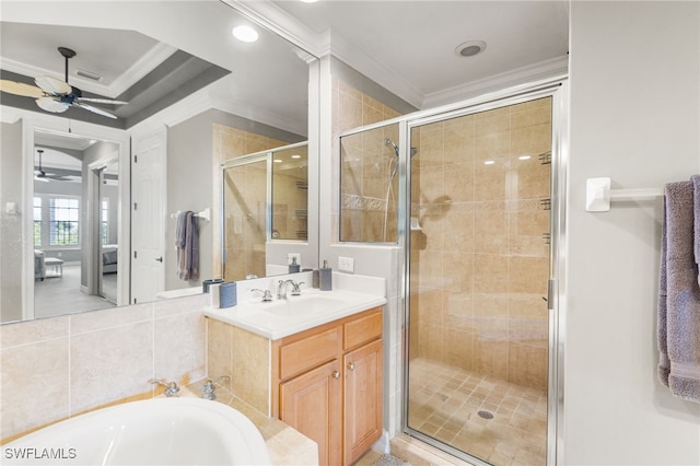 11239 Bienvenida Ct Unit 11C, Fort Myers, FL 33908 - bathroom featuring ornamental molding, ceiling fan, a shower stall, vanity, and a garden tub