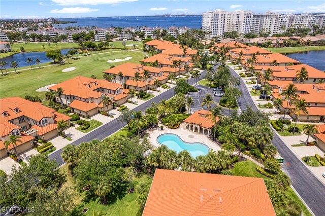 11239 Bienvenida Ct Unit 11C, Fort Myers, FL 33908 - drone / aerial view of apartment complex, a nearby body of water, a pool, and a golf club