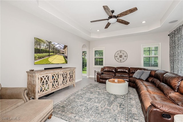 7307 Acorn Way, Naples, FL 34119 - tiled living area with arched walkways, ceiling fan, plenty of natural light, a raised ceiling, and recessed lighting