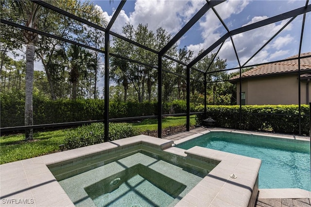 7307 Acorn Way, Naples, FL 34119 - view of pool with a pool with connected hot tub and glass enclosure