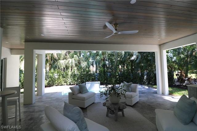 view of patio featuring a ceiling fan and an outdoor living space