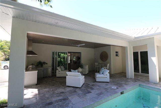rear view of property with exterior kitchen, stucco siding, and a ceiling fan