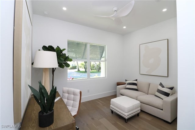 living area featuring baseboards, ceiling fan, recessed lighting, and wood finished floors