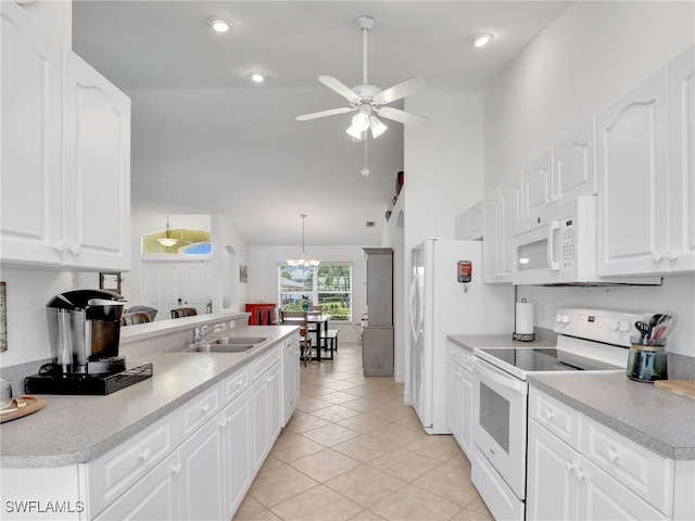 201 SE 4th St, Cape Coral, FL 33990 - kitchen with a sink, white appliances, ceiling fan with notable chandelier, light tile patterned flooring, and high vaulted ceiling