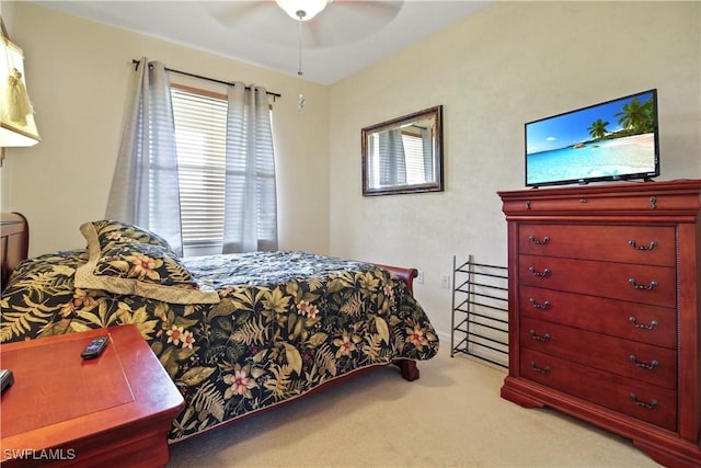 carpeted bedroom with a ceiling fan