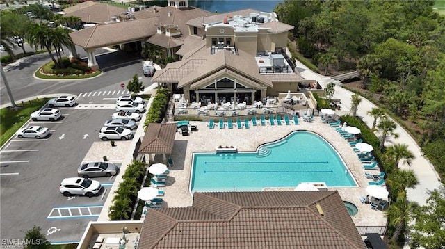 aerial view of property and surrounding area with a pool area