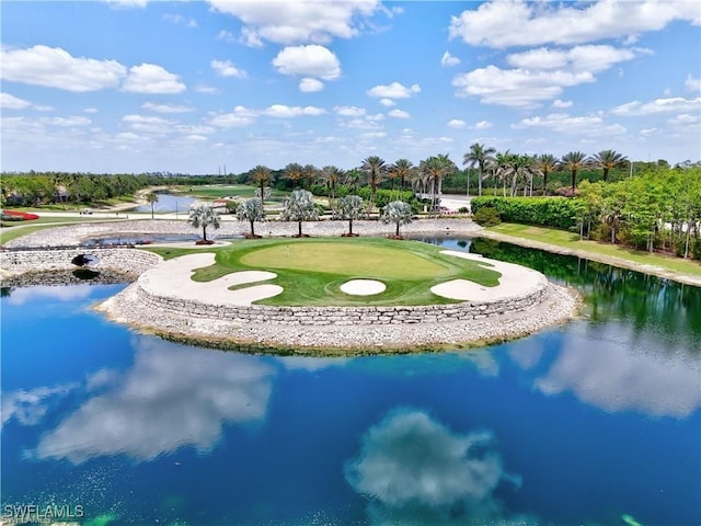 surrounding community featuring a putting area and a water view