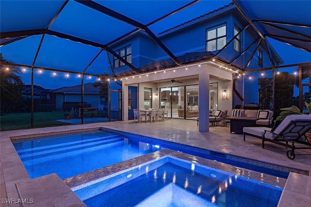 3599 Beaufort Ct, Naples, FL 34119 - pool at twilight with an outdoor hangout area, an in-ground hot tub, a patio, ceiling fan, and an outdoor pool