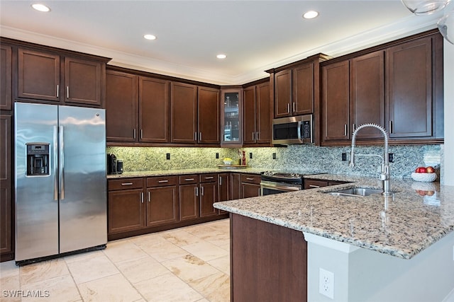 3599 Beaufort Ct, Naples, FL 34119 - kitchen featuring appliances with stainless steel finishes, a sink, light stone counters, dark brown cabinets, and recessed lighting