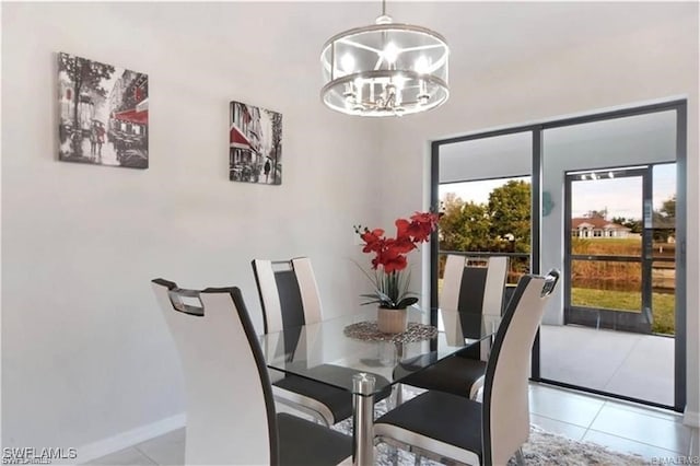4334 SW 9th Pl, Cape Coral, FL 33914 - tiled dining space featuring baseboards and an inviting chandelier