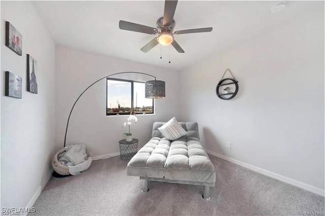 4334 SW 9th Pl, Cape Coral, FL 33914 - sitting room featuring baseboards, a ceiling fan, and carpet floors