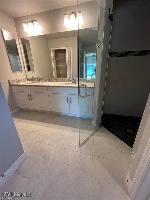 4334 SW 9th Pl, Cape Coral, FL 33914 - bathroom featuring double vanity, a shower stall, and a sink