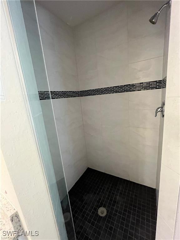 4334 SW 9th Pl, Cape Coral, FL 33914 - bathroom featuring a shower stall