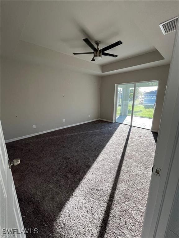 4334 SW 9th Pl, Cape Coral, FL 33914 - empty room with a tray ceiling, carpet flooring, a ceiling fan, and visible vents