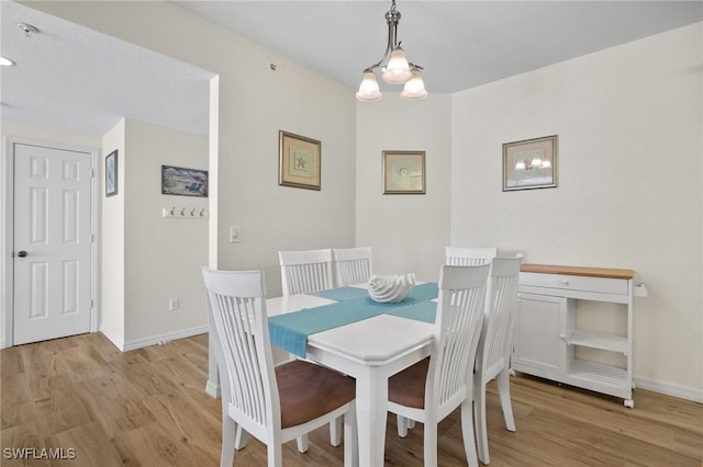 22748 Island Pines Way Unit 102, Fort Myers Beach, FL 33931 - dining space with light wood-style flooring and baseboards