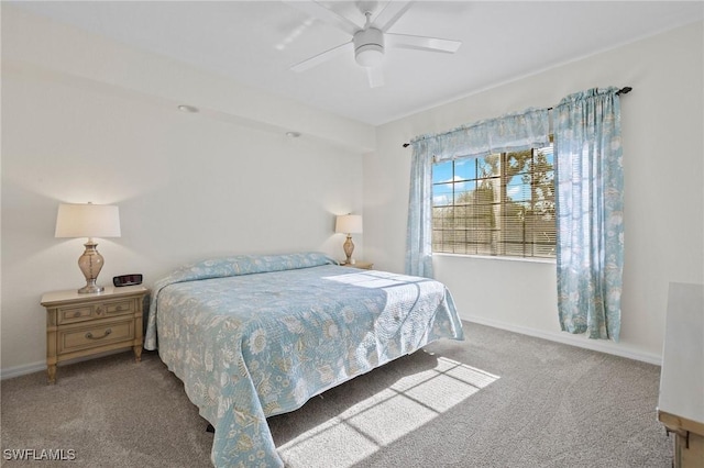 carpeted bedroom featuring baseboards and ceiling fan
