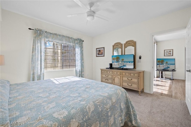 22748 Island Pines Way Unit 102, Fort Myers Beach, FL 33931 - bedroom with light carpet, a ceiling fan, and baseboards