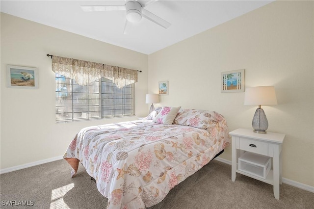 carpeted bedroom featuring baseboards and a ceiling fan