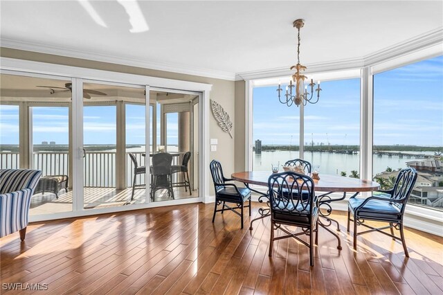 4137 Bay Beach Ln Unit 585, Fort Myers Beach, FL 33931 - sunroom with a water view and an inviting chandelier