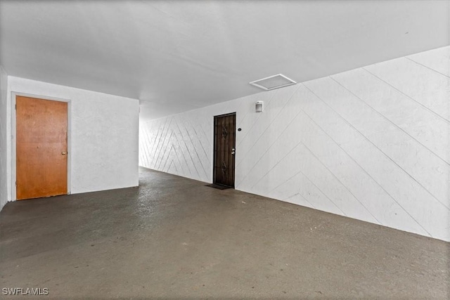 additional living space featuring concrete floors