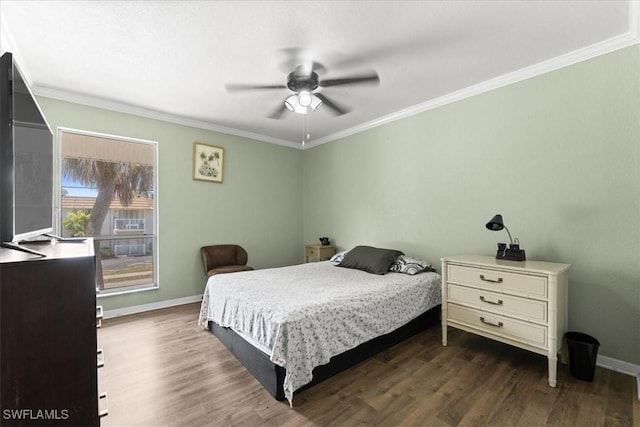 bedroom with dark wood-style flooring, crown molding, baseboards, and a ceiling fan