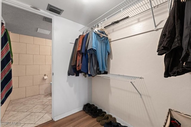 spacious closet featuring wood finished floors