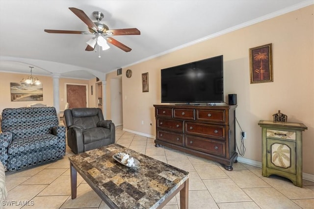 living area featuring decorative columns, arched walkways, a ceiling fan, light tile patterned floors, and ornamental molding