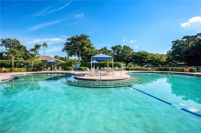 community pool with a patio area