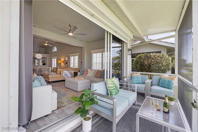 sunroom featuring vaulted ceiling