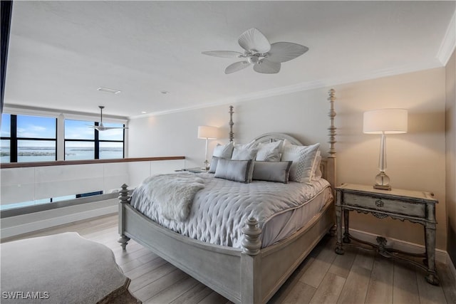 17080 Harbour Point Dr Unit 12B, Fort Myers, FL 33908 - bedroom with wood finished floors, a water view, ornamental molding, baseboards, and a ceiling fan