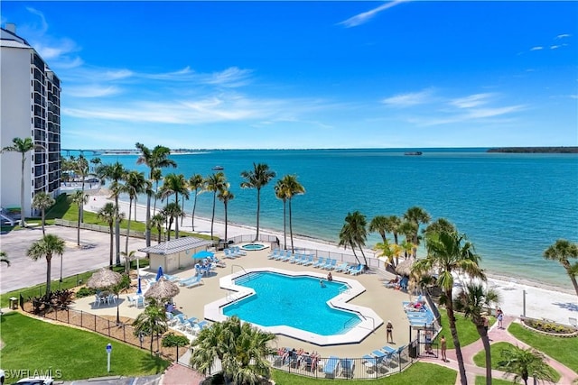 17080 Harbour Point Dr Unit 12B, Fort Myers, FL 33908 - community pool with view of water and beach, a patio, and fence