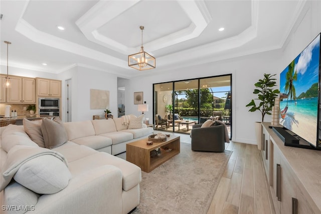 28009 Foxrock Ct, Bonita Springs, FL 34135 - living area with a tray ceiling, a chandelier, light wood-style flooring, and recessed lighting