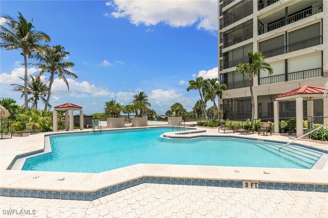 100 N Collier Blvd Unit 507, Marco Island, FL 34145 - community pool featuring a gazebo and a patio