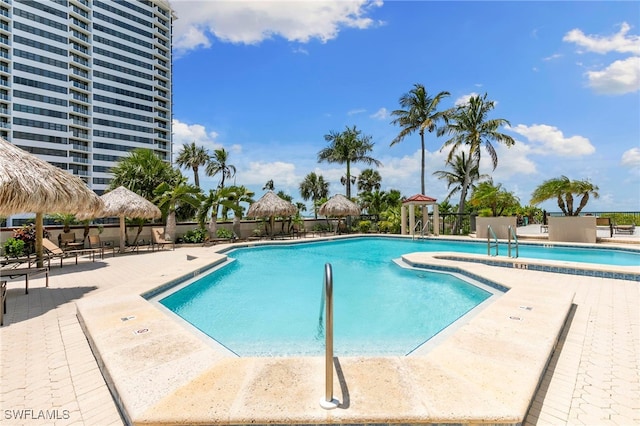 100 N Collier Blvd Unit 507, Marco Island, FL 34145 - community pool featuring a gazebo and a patio area