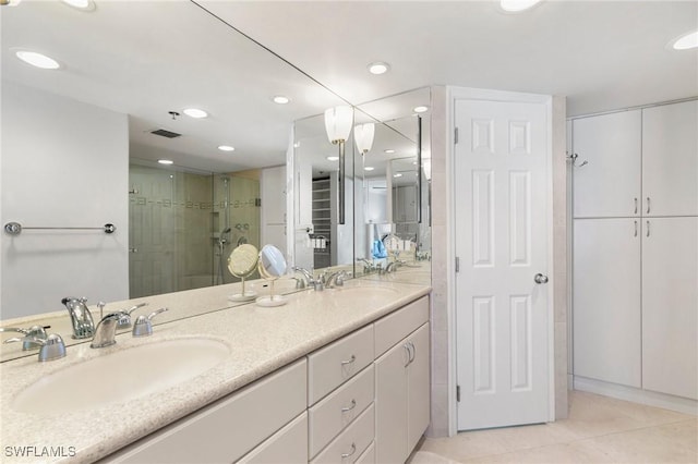 100 N Collier Blvd Unit 507, Marco Island, FL 34145 - full bathroom with a closet, double vanity, tile patterned floors, a stall shower, and recessed lighting