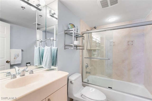 100 N Collier Blvd Unit 507, Marco Island, FL 34145 - bathroom with toilet, vanity, and enclosed tub / shower combo