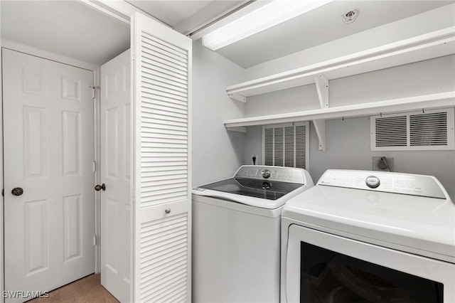 100 N Collier Blvd Unit 507, Marco Island, FL 34145 - laundry area with separate washer and dryer and light carpet