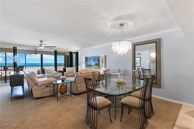 100 N Collier Blvd Unit 507, Marco Island, FL 34145 - dining area with a chandelier, ceiling fan, ornamental molding, light carpet, and a wall of windows