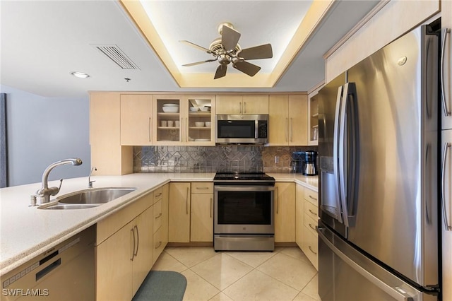 100 N Collier Blvd Unit 507, Marco Island, FL 34145 - kitchen featuring light brown cabinetry, appliances with stainless steel finishes, a sink, light countertops, and recessed lighting