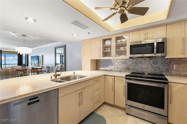 100 N Collier Blvd Unit 507, Marco Island, FL 34145 - kitchen with appliances with stainless steel finishes, light brown cabinetry, a sink, light countertops, and recessed lighting