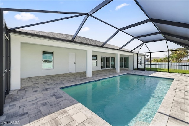 outdoor pool with a patio area