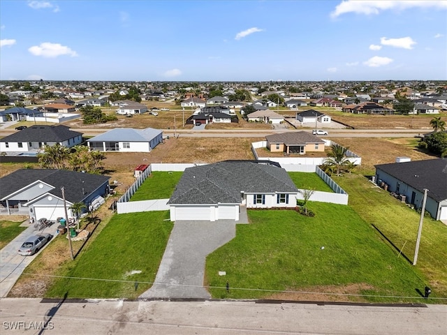 birds eye view of property with a residential view