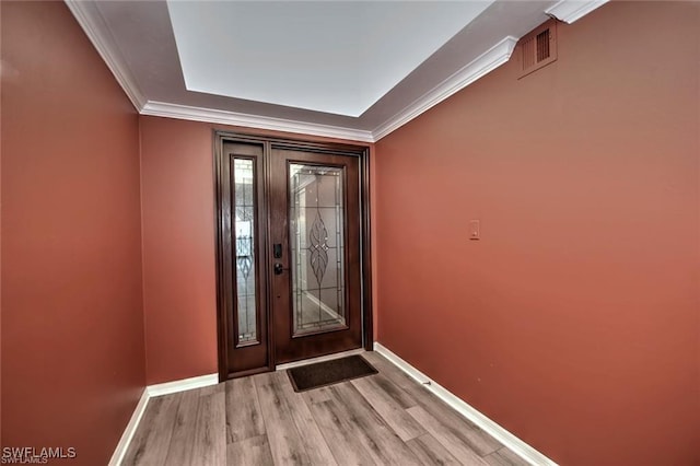 1910 Virginia Ave Unit 1302, Fort Myers, FL 33901 - foyer entrance with baseboards, wood finished floors, and crown molding